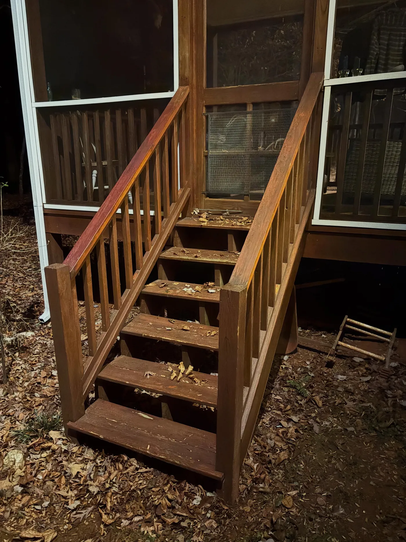 Before: weathered back stairs with rotting railings