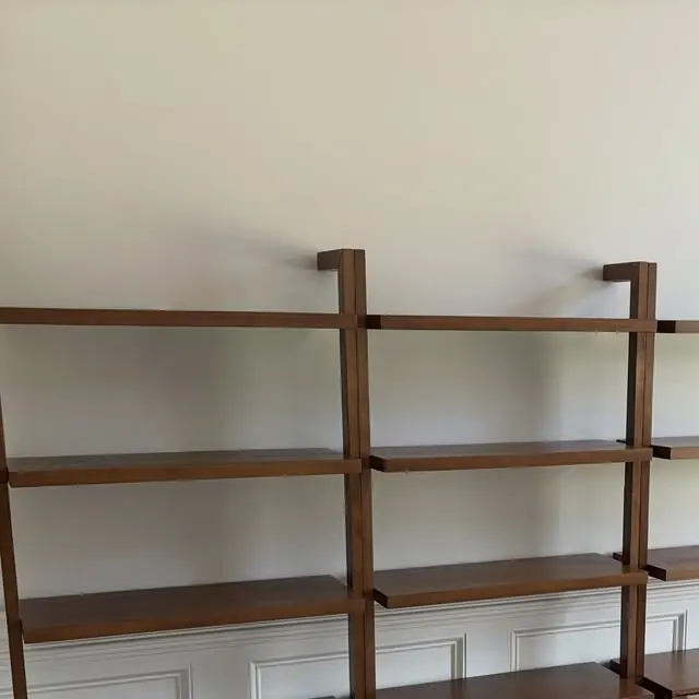 Wall of wooden shelving units installed in a homeschool room